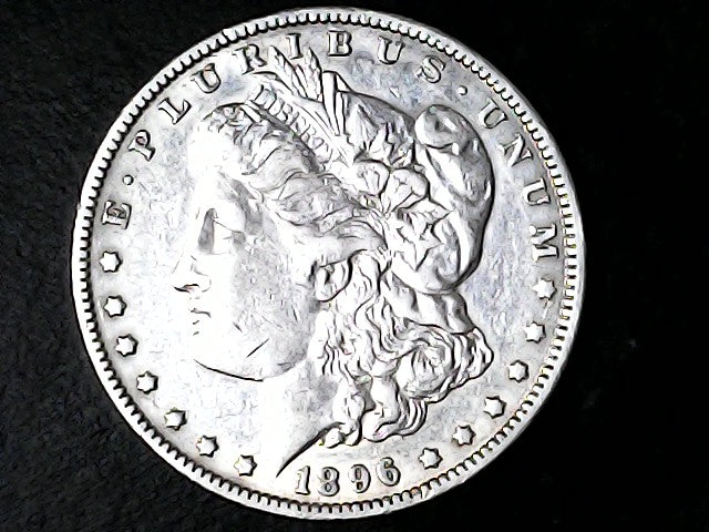 Silver Morgan Dollar Left-facing profile of Liberty wearing a Phrygian cap, with 'LIBERTY', "E PLURIBUS UNUM" and '1896' inscriptions on a black background with case