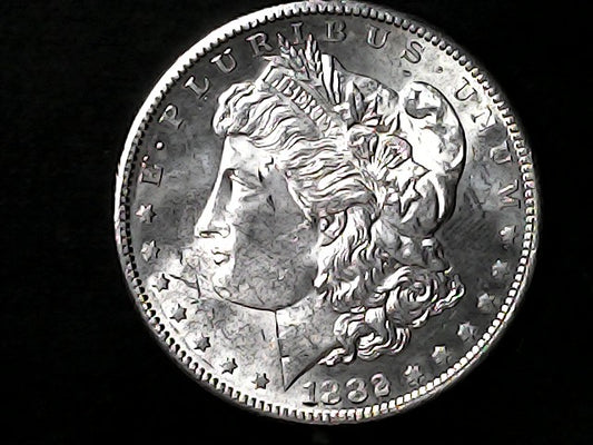 Silver Morgan Dollar Left-facing profile of Liberty wearing a Phrygian cap, with 'LIBERTY', "E PLURIBUS UNUM" and '1882' inscriptions on a black background with case
