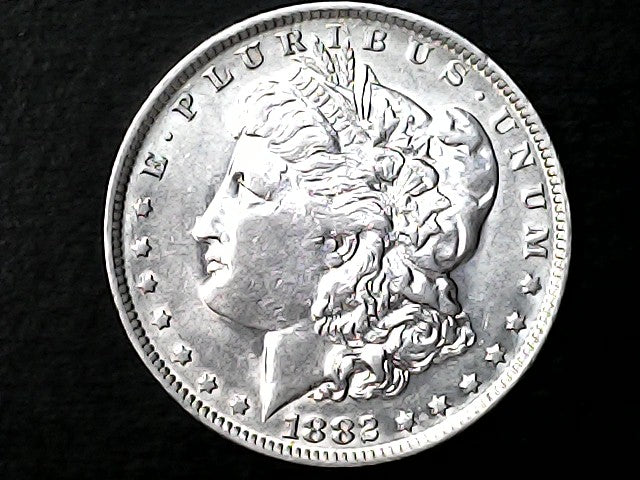 Silver Morgan Dollar Left-facing profile of Liberty wearing a Phrygian cap, with 'LIBERTY', "E PLURIBUS UNUM" and '1882' inscriptions on a black background with case