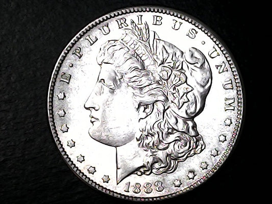 Silver Morgan Dollar coin with 'E Pluribus Unum' and '1888' inscription on a black background