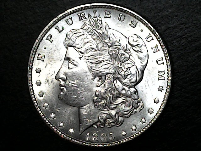 1885 Morgan Dollar with Liberty on a black background