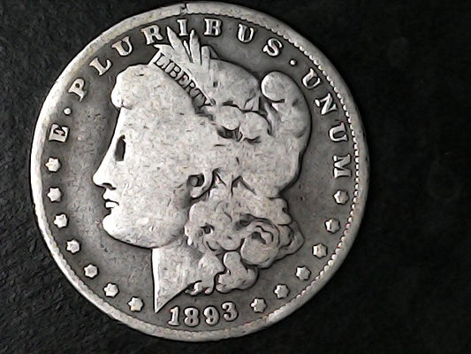 Silver Morgan Dollar Left-facing profile of Liberty wearing a Phrygian cap, with 'LIBERTY', "E PLURIBUS UNUM" and '1893' inscriptions on a black background with case