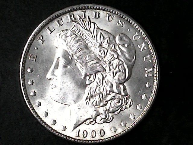 Silver Morgan Dollar Left-facing profile of Liberty wearing a Phrygian cap, with 'LIBERTY', "E PLURIBUS UNUM" and '1900' inscriptions on a black background with case