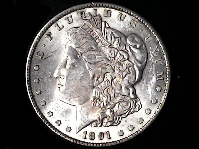 Silver Morgan Dollar Left-facing profile of Liberty wearing a Phrygian cap, with 'LIBERTY', "E PLURIBUS UNUM" and '1891' inscriptions on a black background with case