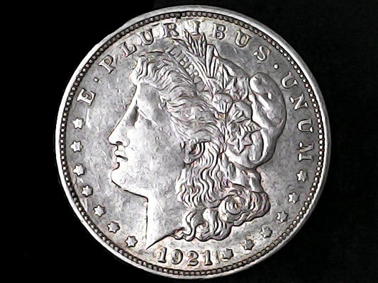 Silver Morgan Dollar Left-facing profile of Liberty wearing a Phrygian cap, with 'LIBERTY', "E PLURIBUS UNUM" and '1921' inscriptions on a black background with case