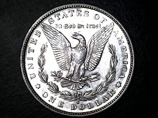 Silver dollar coin with an eagle design, a "S" at the bottom on a dark background