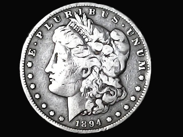 Silver Morgan Dollar Left-facing profile of Liberty wearing a Phrygian cap, with 'LIBERTY', "E PLURIBUS UNUM" and '1894' inscriptions on a black background with case 