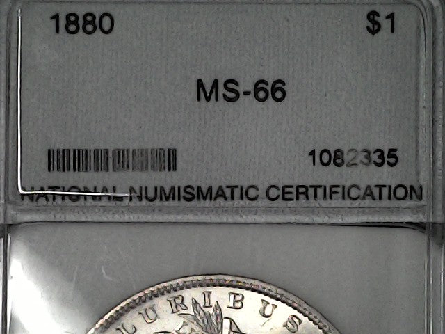 Silver coin in a holder with certification label showing '1880' and 'MS-66'.