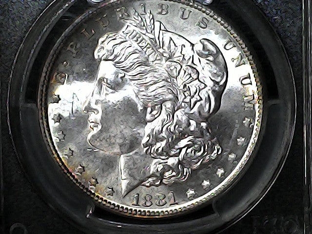Silver Morgan dollar coin in a protective case