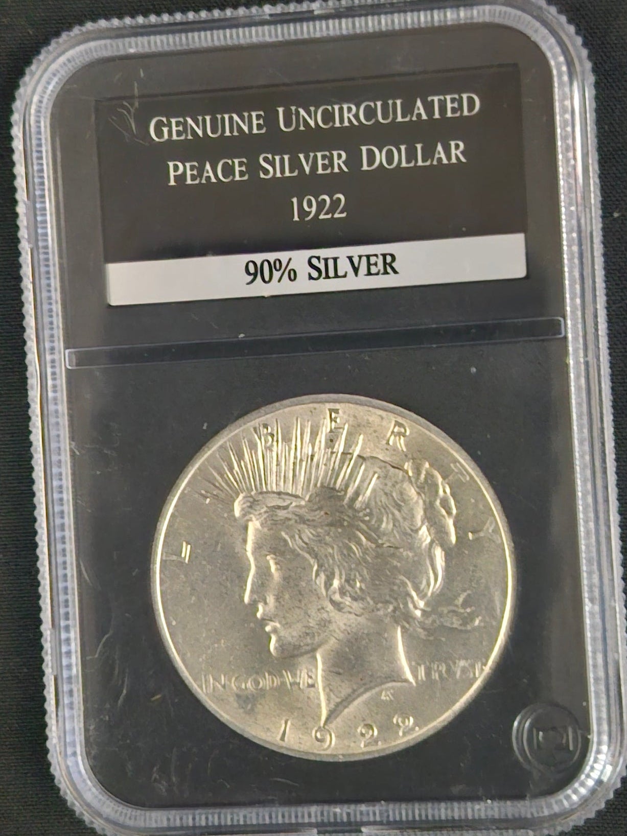 Genuine Uncirculated '1922' Peace silver dollar in  protective clear case
