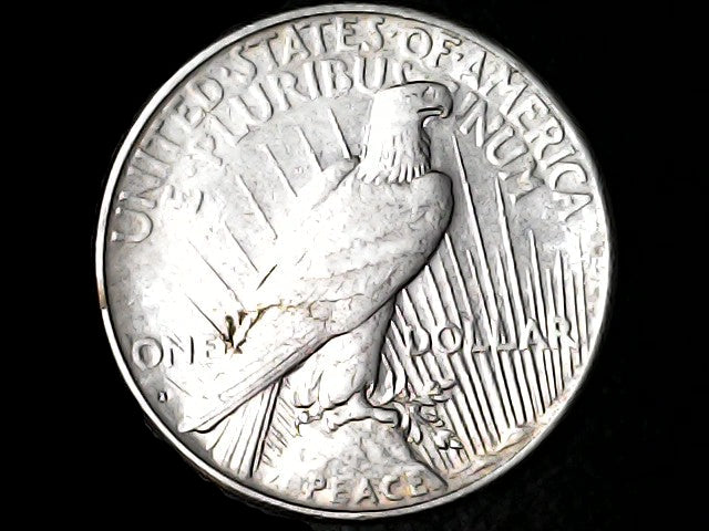 Silver Peace Dollar coin with an eagle emblem and 'S' inscription