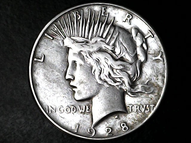 1928 Peace dollar with inscription 'LIBERTY' and 'In God We Trvst'
