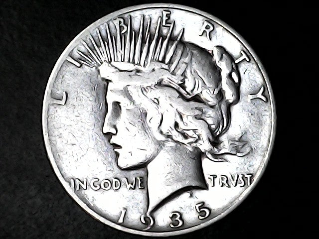 1935 silver Peace dollar with 'Liberty' and 'In God We Trust' inscriptions