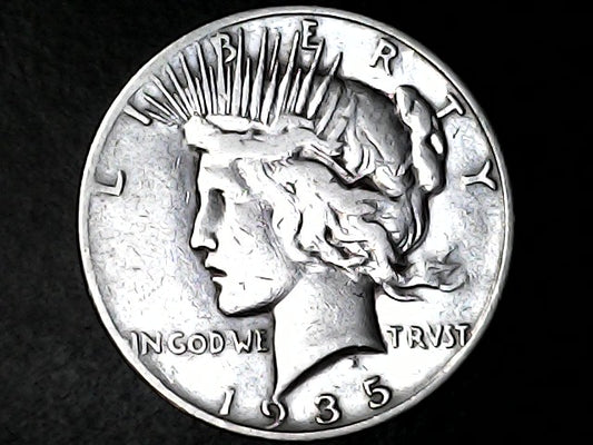 1935 silver Peace dollar with 'Liberty' and 'In God We Trust' inscriptions