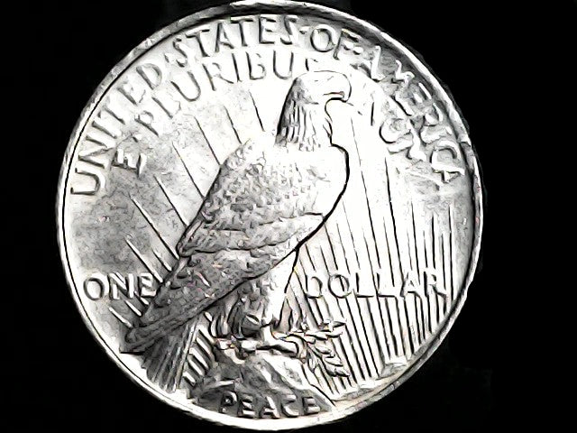 Silver eagle emblem and 'PEACE' on a dark background