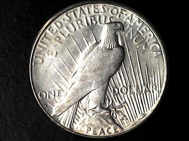 Silver Peace Dollar coin with an eagle design and 'S' inscription on a black background