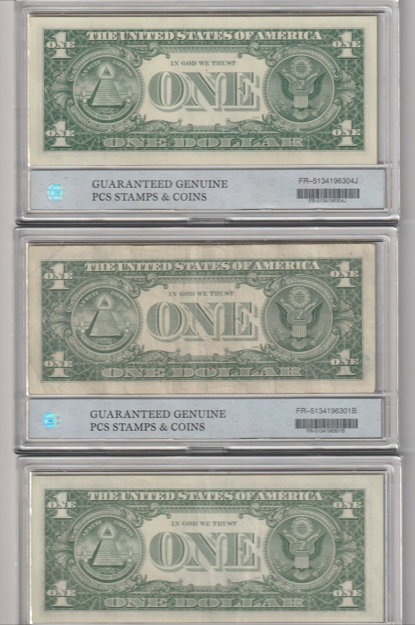 Three U.S. dollar bills in a holder with 'Guaranteed Genuine' stamps