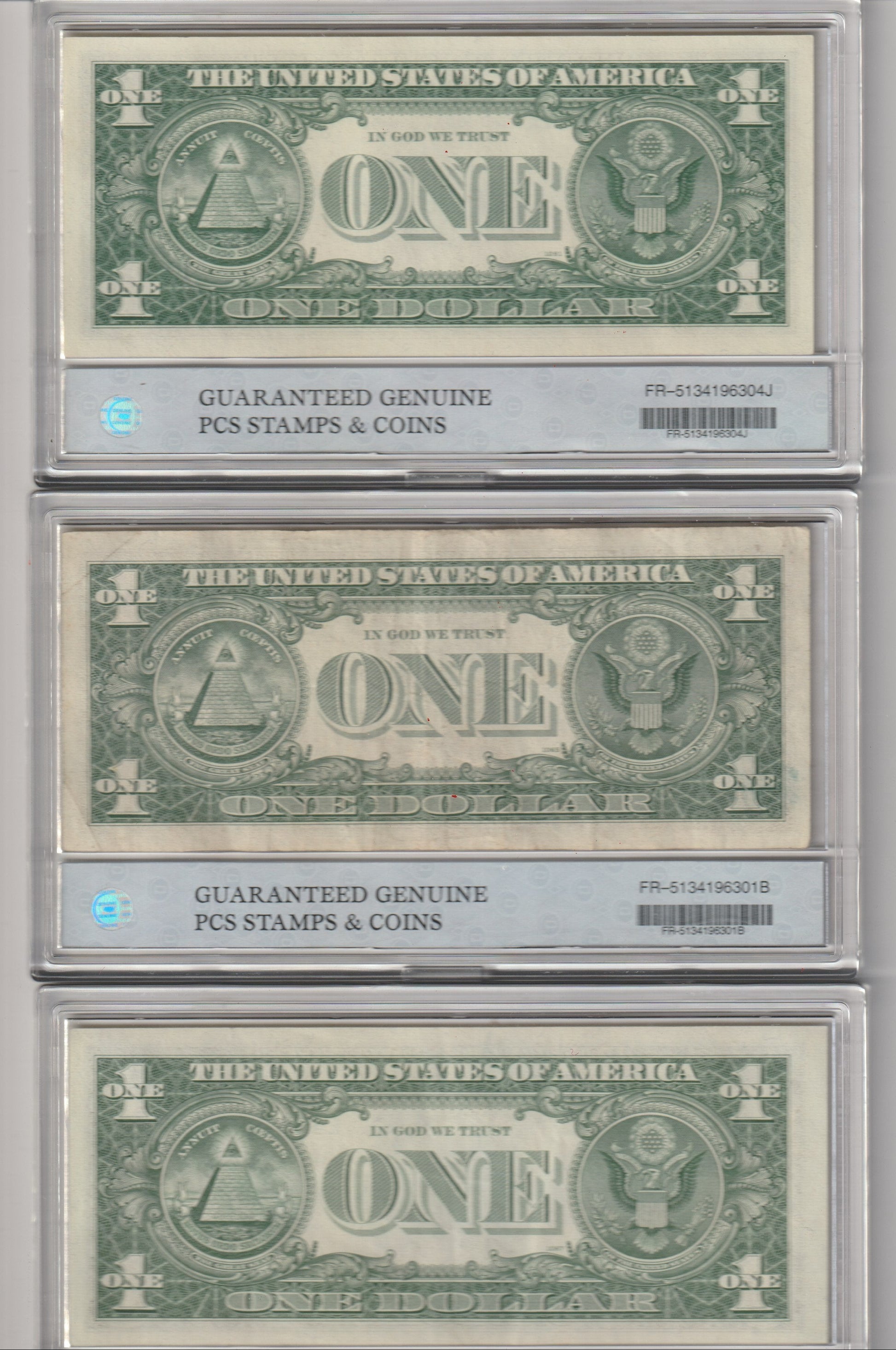 Three U.S. dollar bills in a holder with 'Guaranteed Genuine' stamps